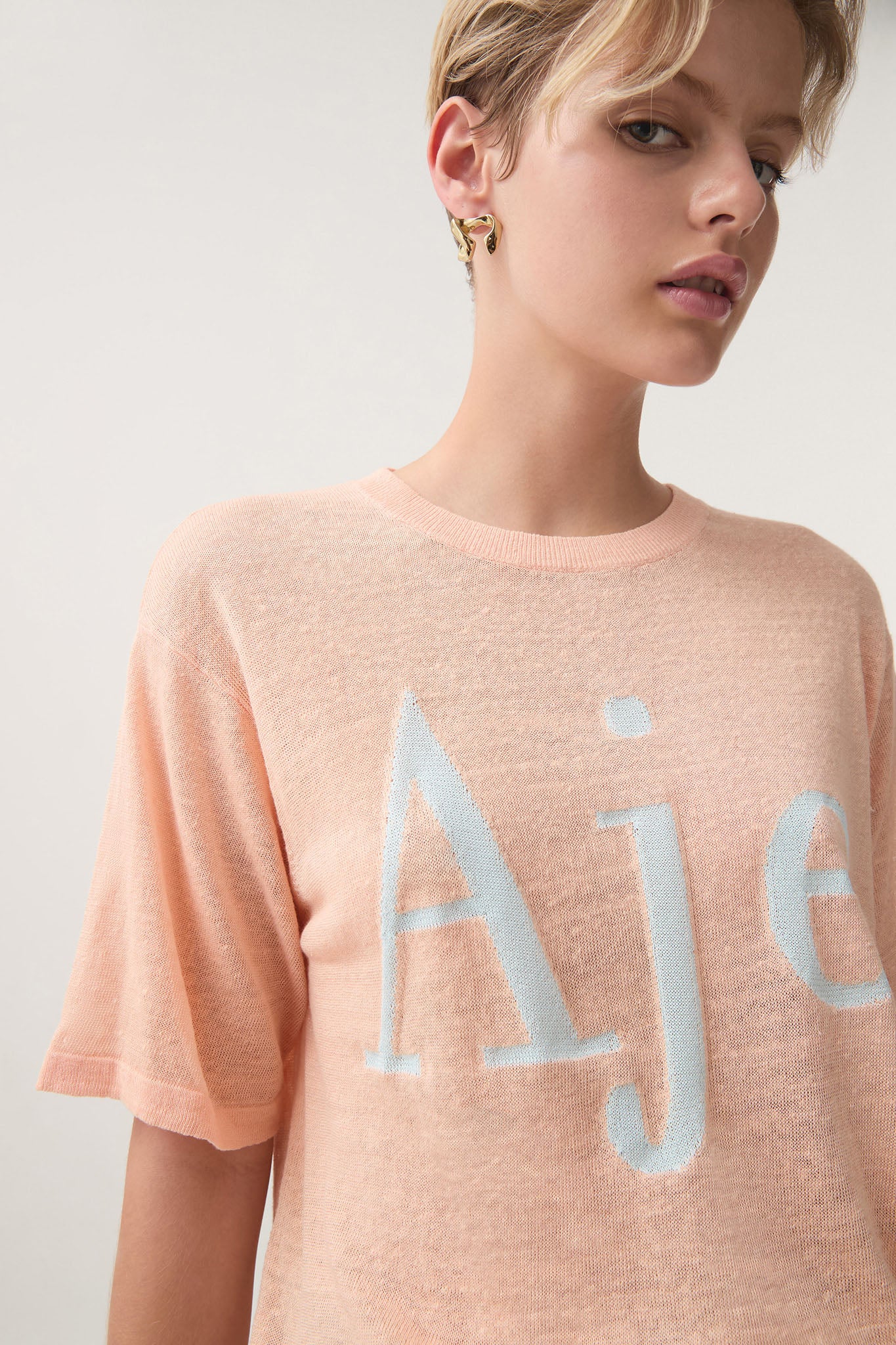 Fascinations Logo Knit Tee - Image 4